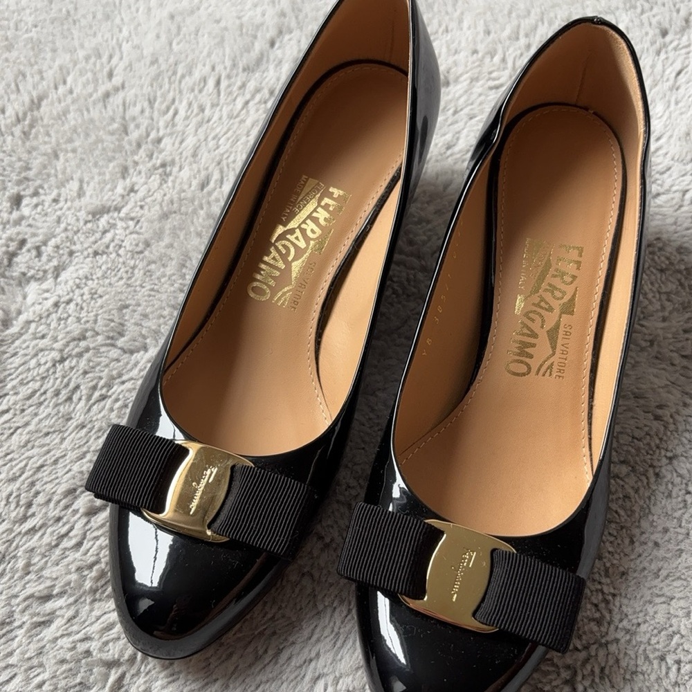 Salvatore Ferragamo Black Vara Patent Leather wedge heel.